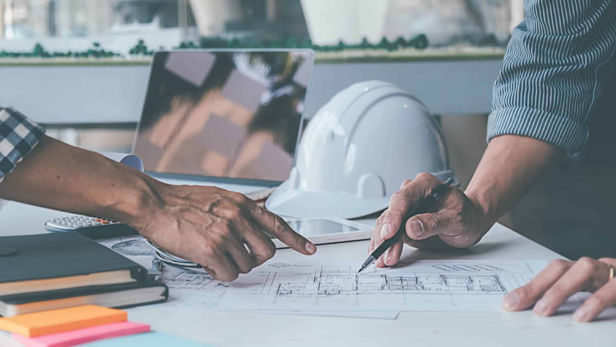 Professional reviewing construction plans