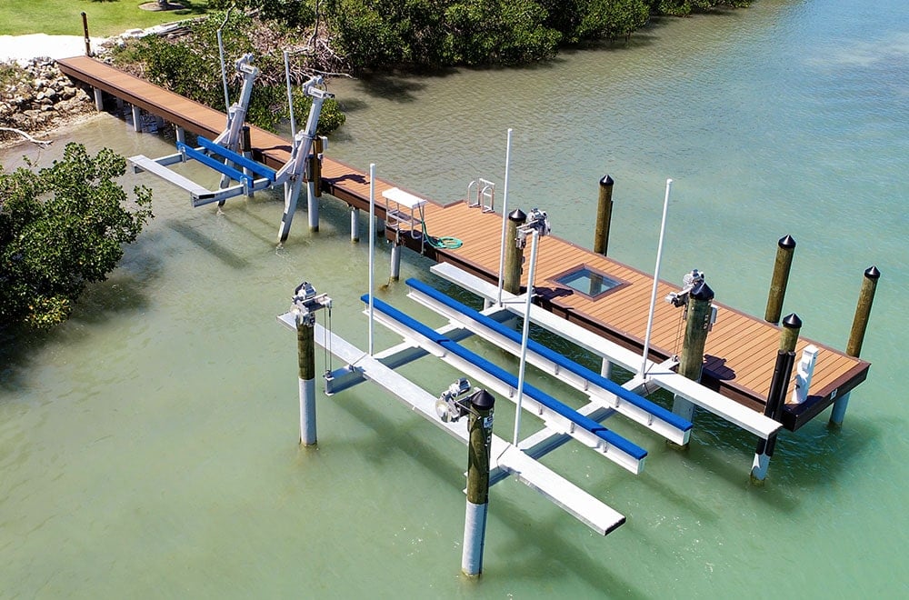 Residential boat dock and boat lifts on calm Florida water
